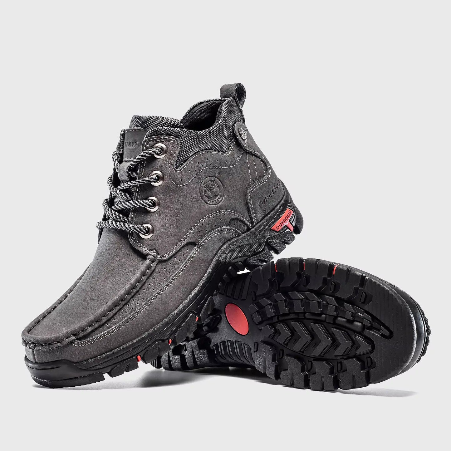 Non-slip rubber outsole traction of Flyland Land2511 gray boots for urban walking.