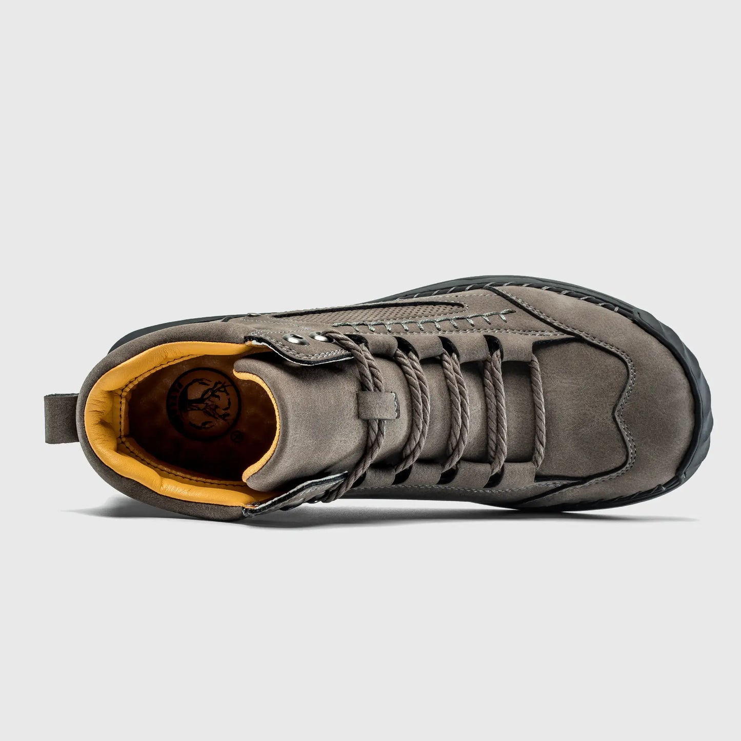 Top down view into Flyland gray ankle boots, displaying the roomy toe box and breathable interior lining.