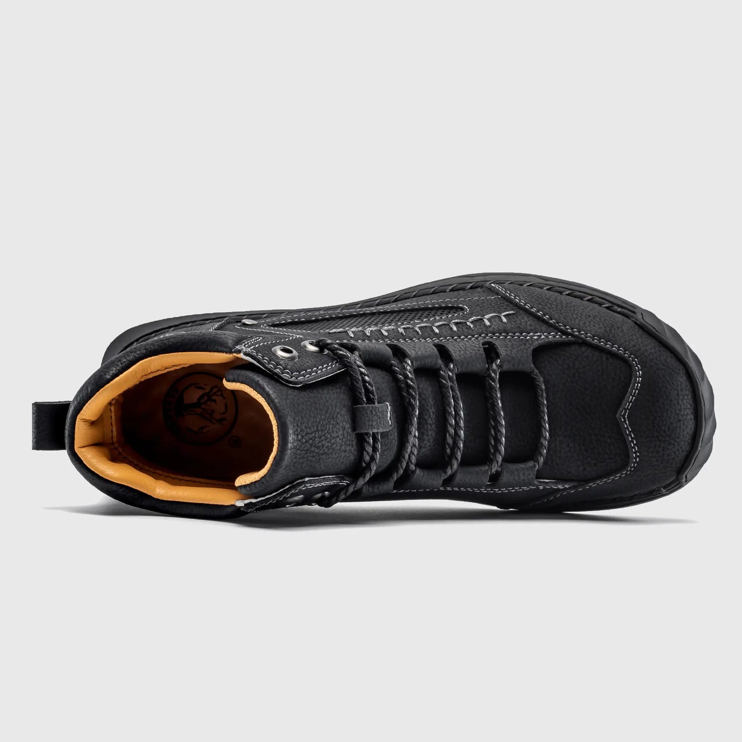 Top down view into Flyland black ankle boots, highlighting the roomy toe box and cushioned interior lining.