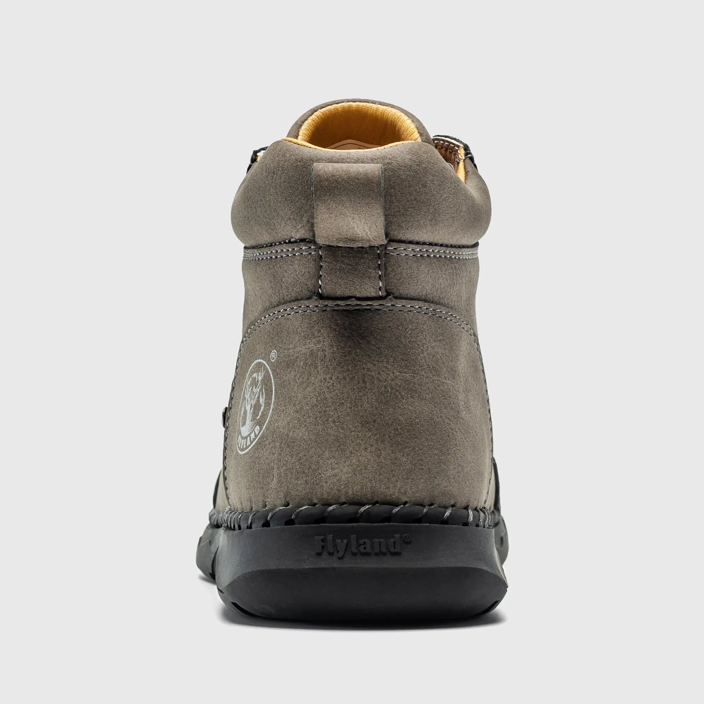 Back view of Flyland men's ankle boots in gray, showcasing the reinforced heel support and embossed brand logo.