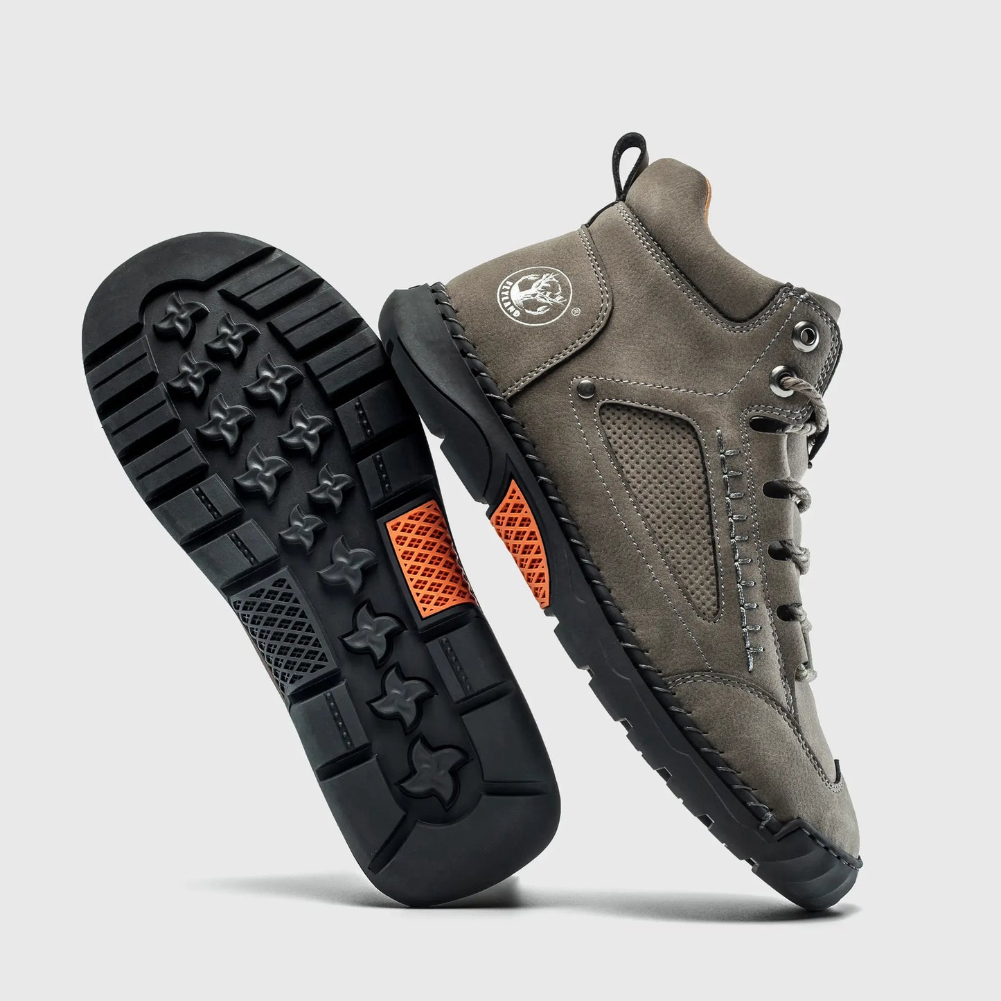 Durable rubber outsole of Flyland gray ankle boots, designed with non-slip traction for walking stability.