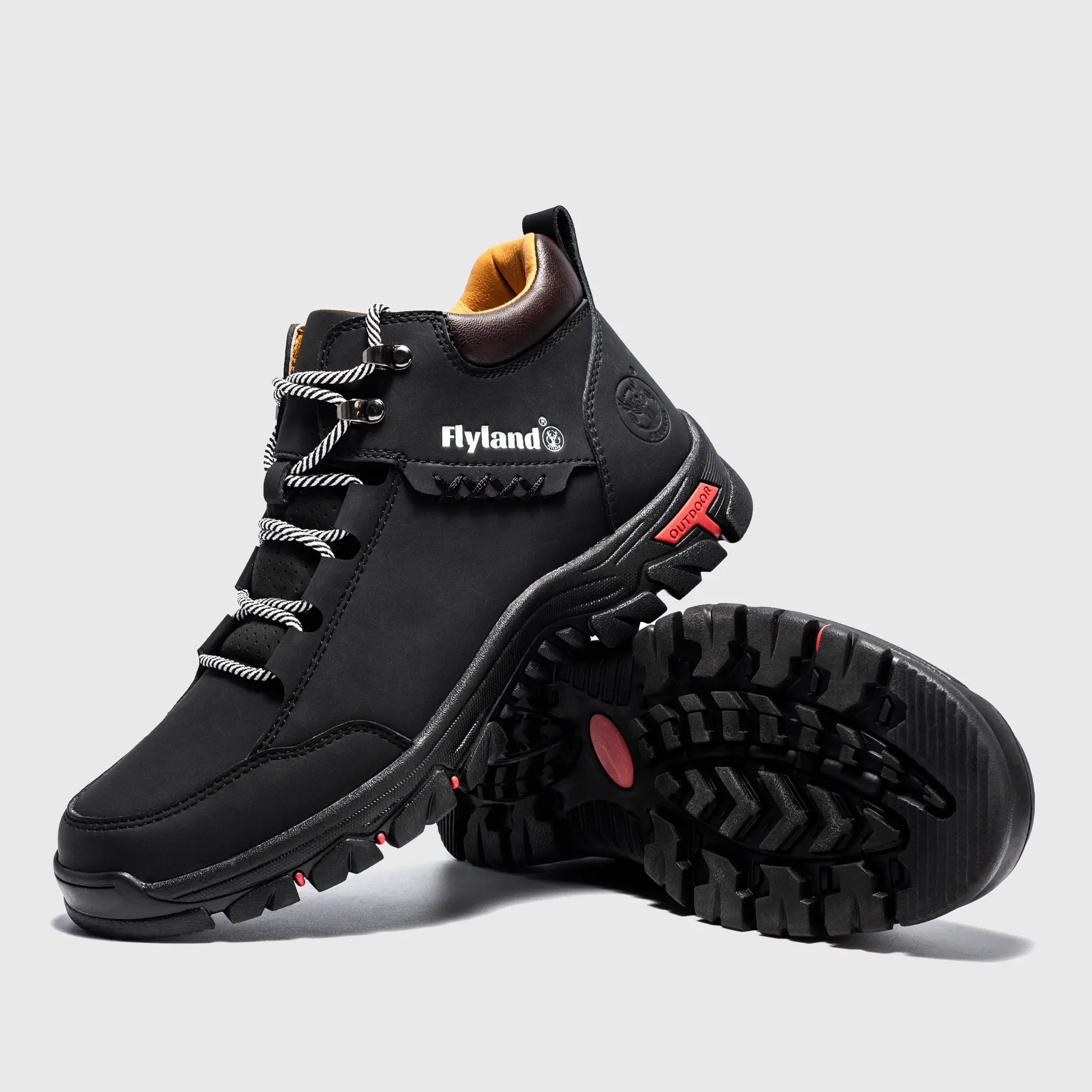 Angled view of Flyland black men's boots featuring a versatile plain toe design suitable for uniforms or street style.