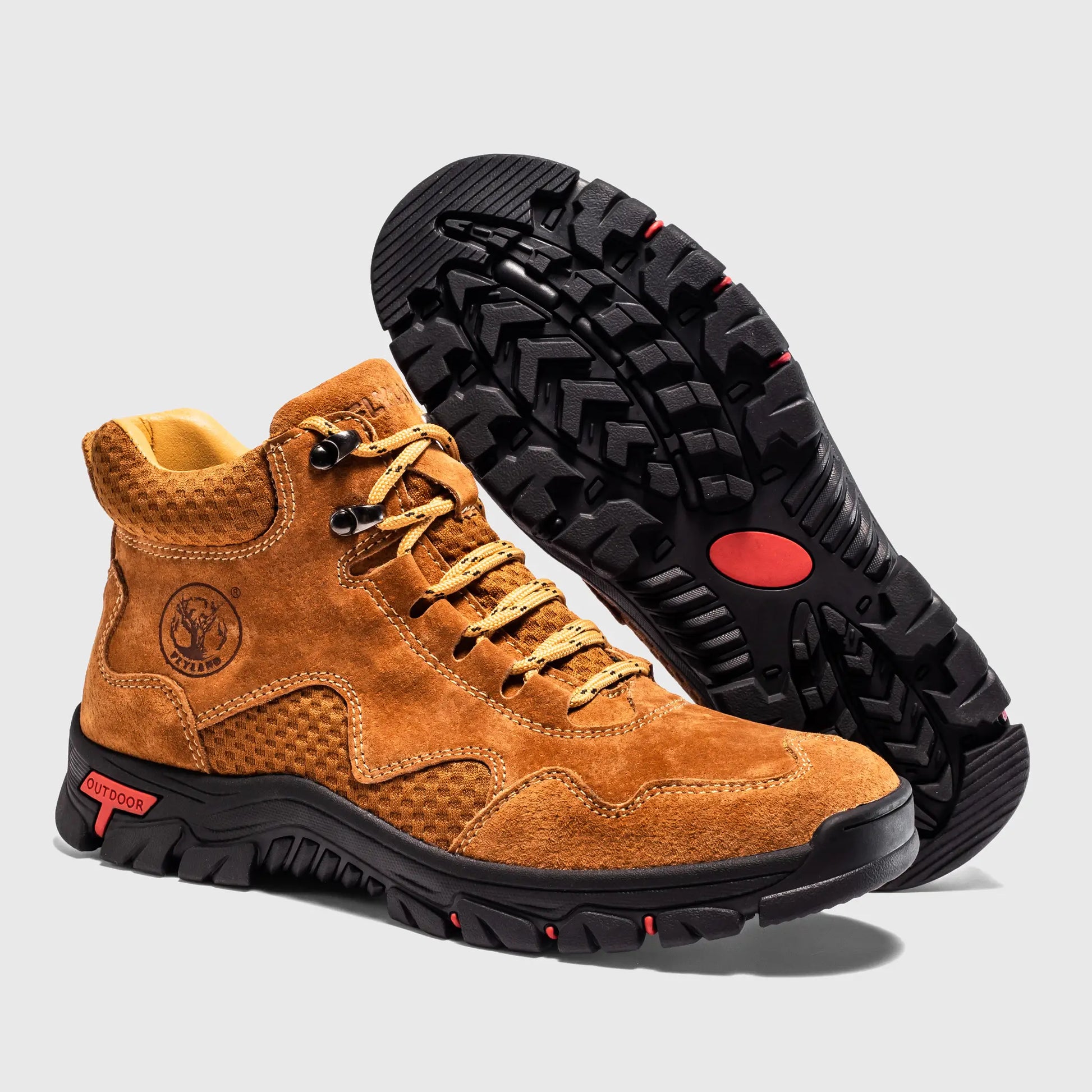 Rugged non-slip outsole of Flyland camel men's outdoor boots, providing traction for walking.