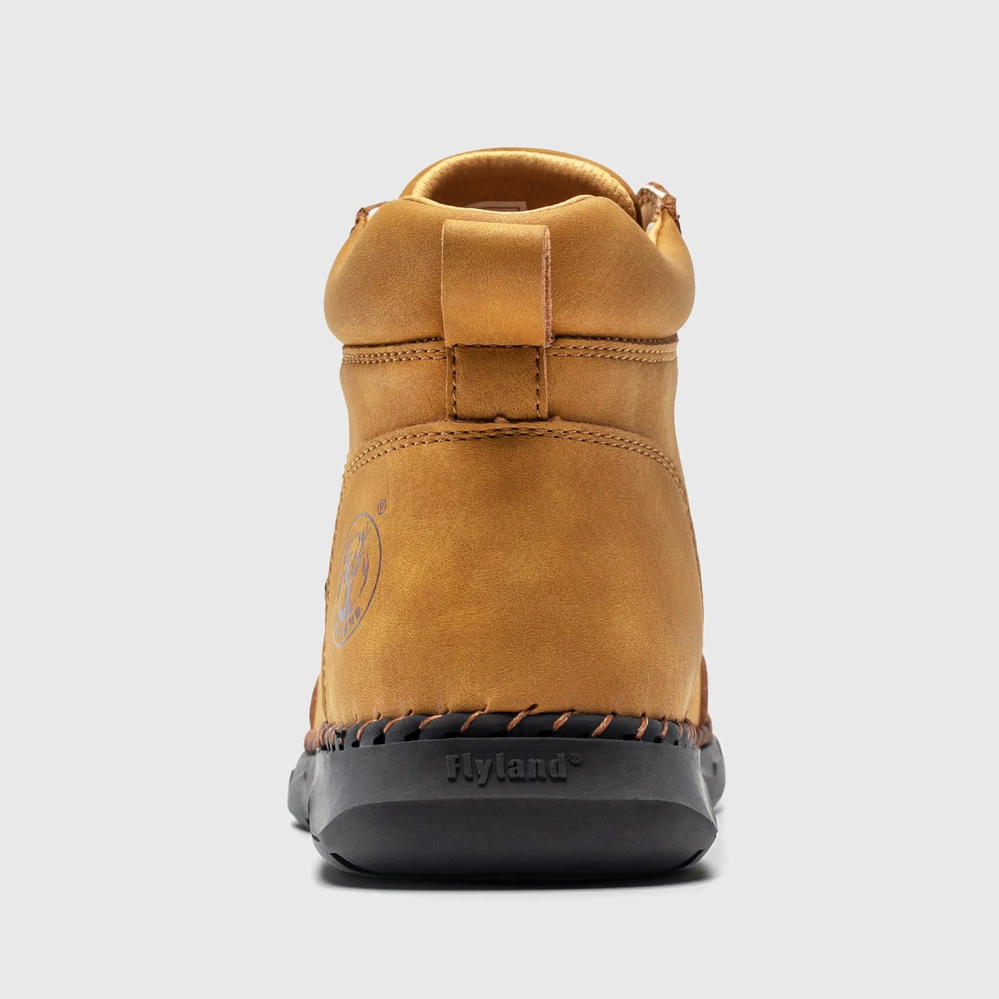 Back heel view of Flyland men's casual boots in wheat, featuring sturdy stitching and the brand logo.