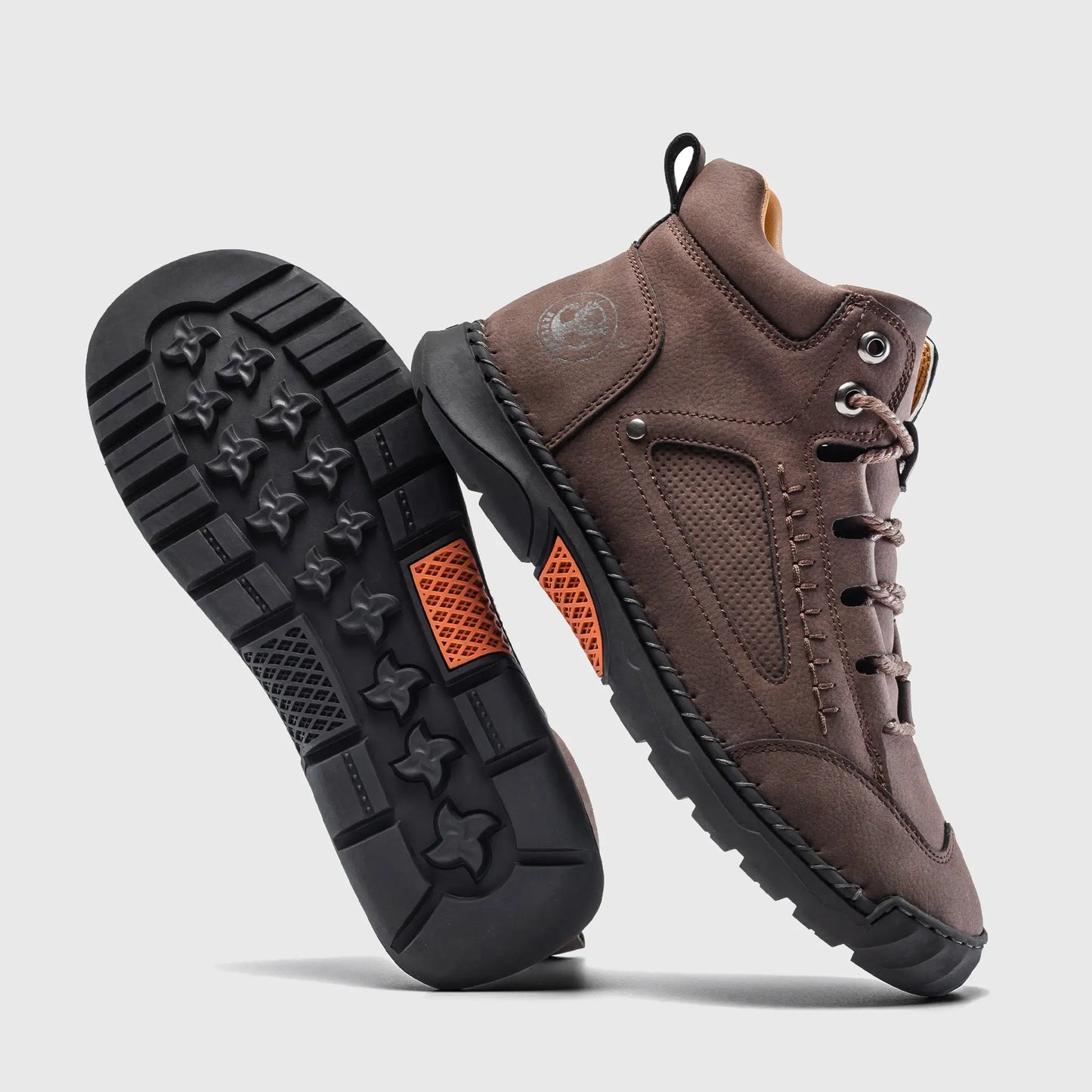 Durable rubber outsole of Flyland dark brown casual boots, designed with a non-slip pattern for walking stability.
