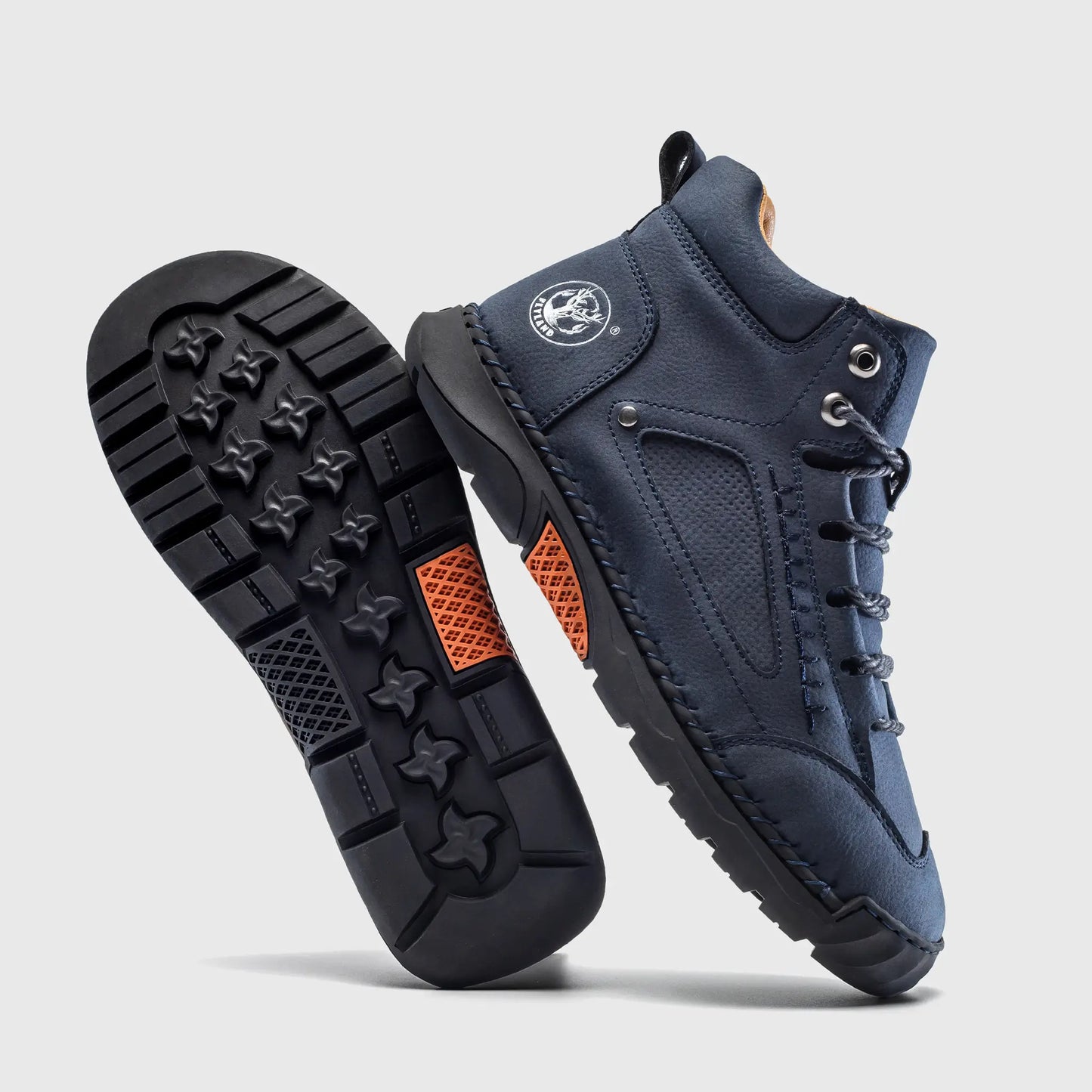 Durable rubber outsole of Flyland men's casual boots, featuring a non-slip pattern designed for walking stability.