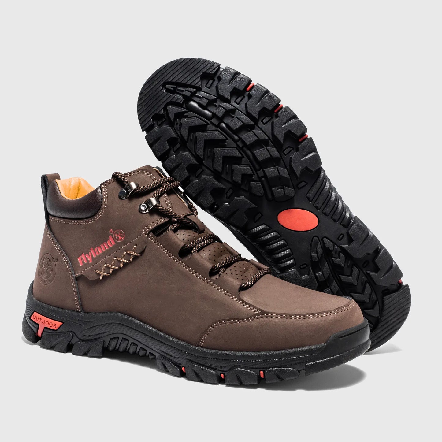 Rugged black rubber outsole of Flyland coffee men's boots, providing non-slip traction on various surfaces.