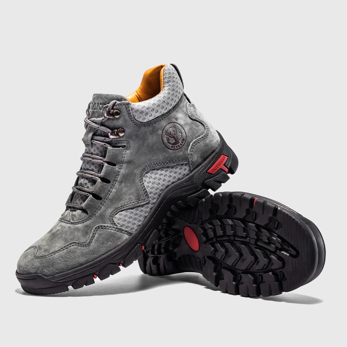 Angled view highlighting the charcoal gray texture and mesh panels of these suede boots.