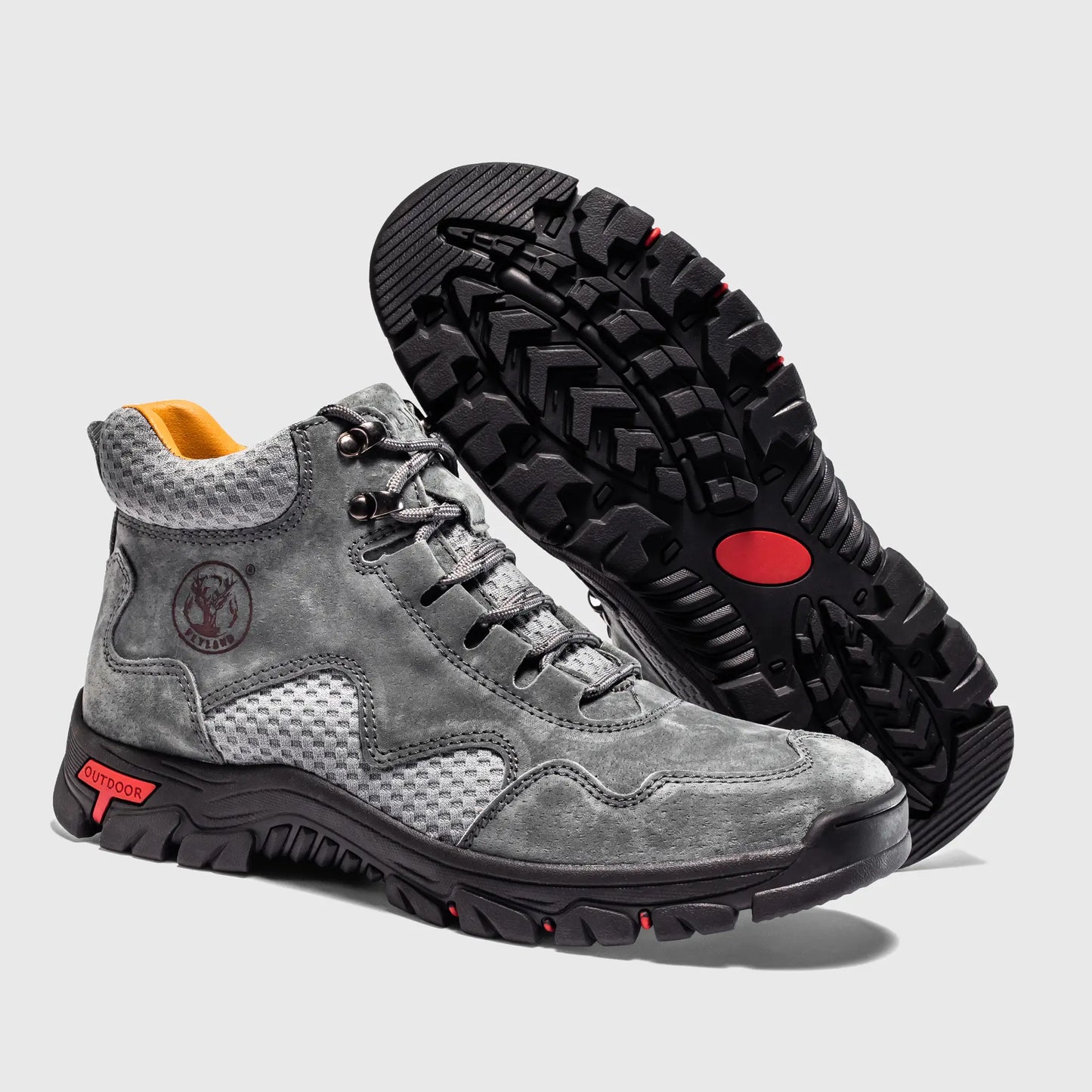 Durable non-slip outsole of Flyland gray men's outdoor boots, providing traction for walking.