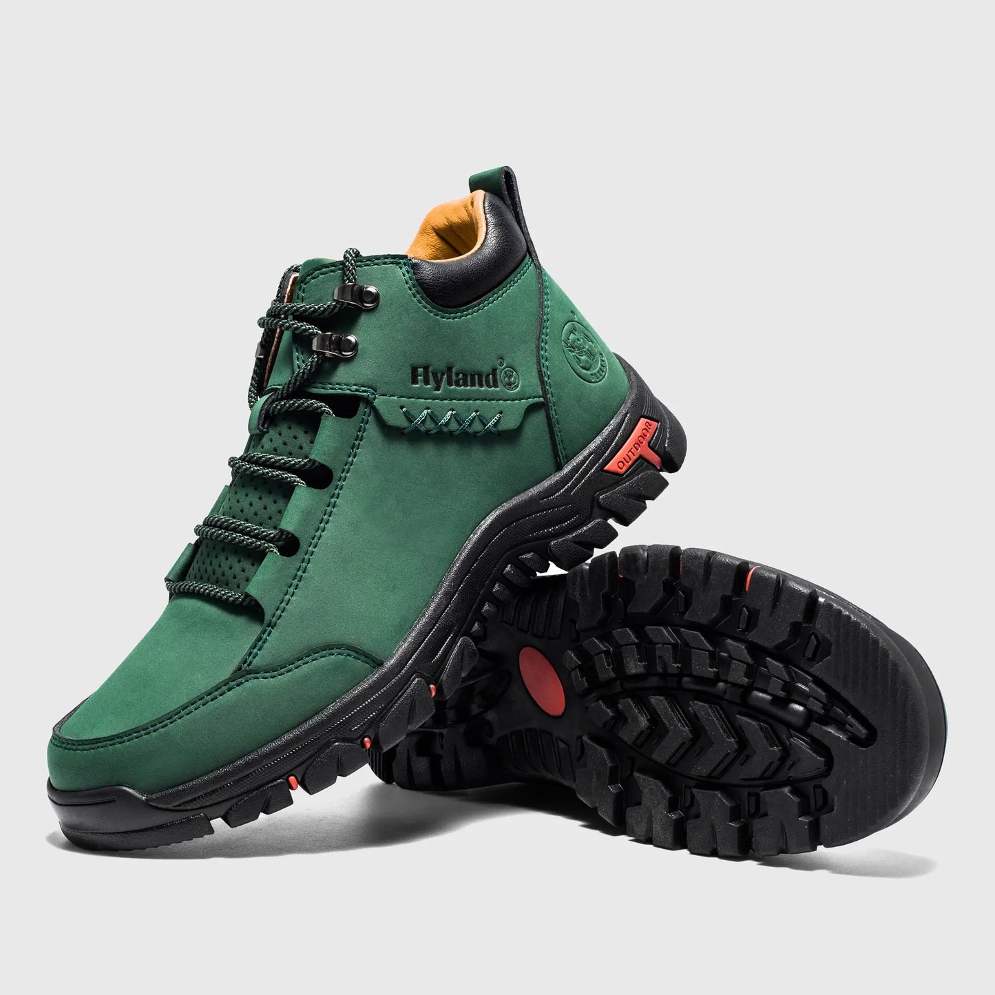 Angled view of Flyland dark green boots highlighting the plain toe and metal D-ring eyelets.