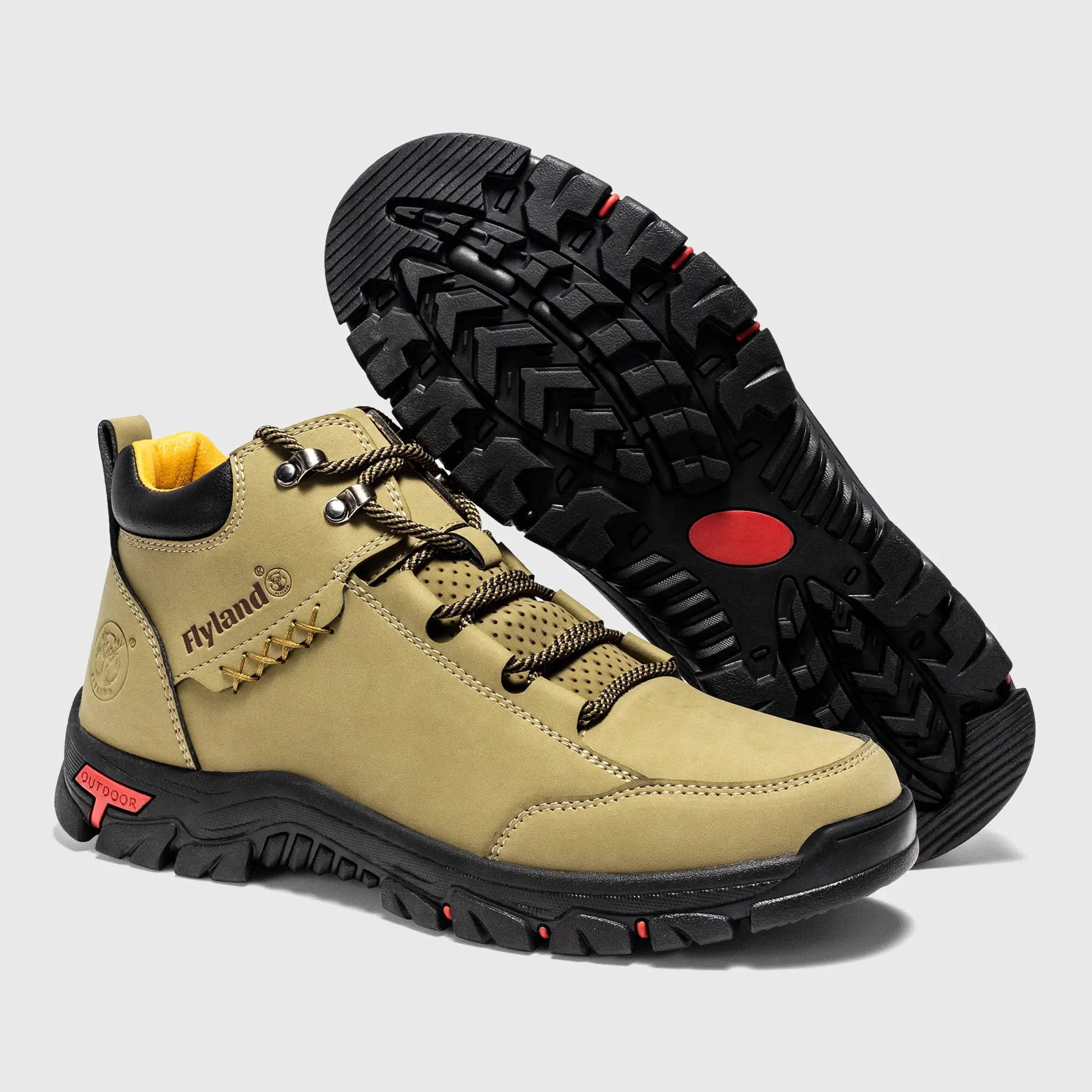 Non-slip rubber outsole of Flyland khaki outdoor boots, providing traction on dry and sandy terrain.