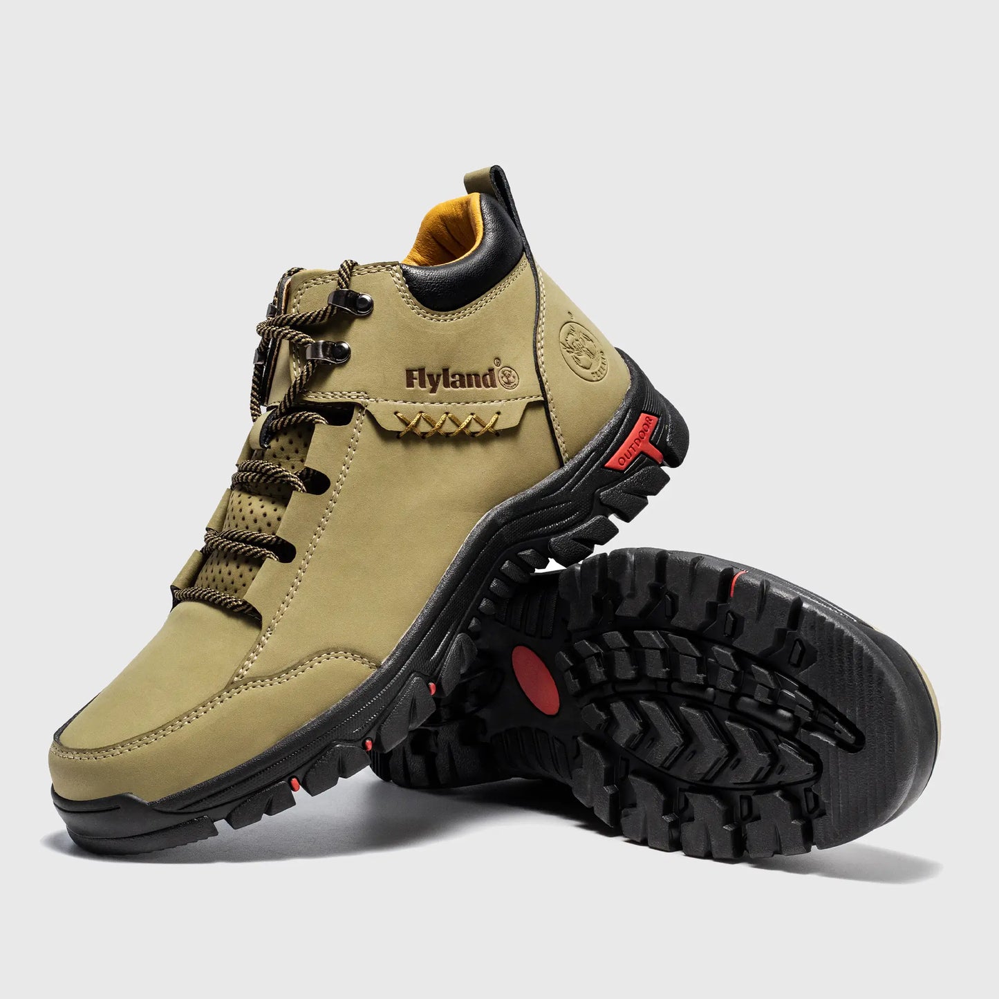 Angled view of Flyland men's khaki boots highlighting the stylish plain toe and rugged metal eyelets.