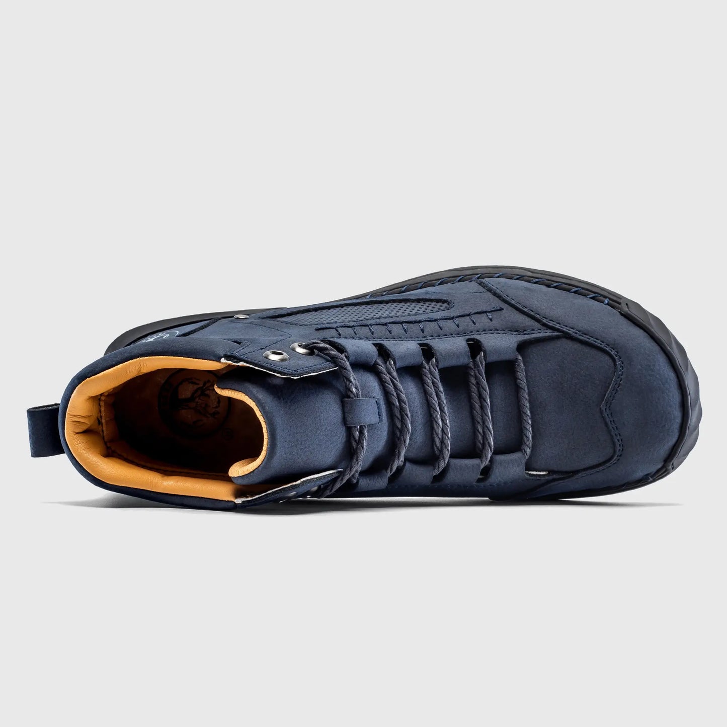 Top down view of Flyland men's lace up boots, displaying the roomy toe box area and cushioned interior lining.