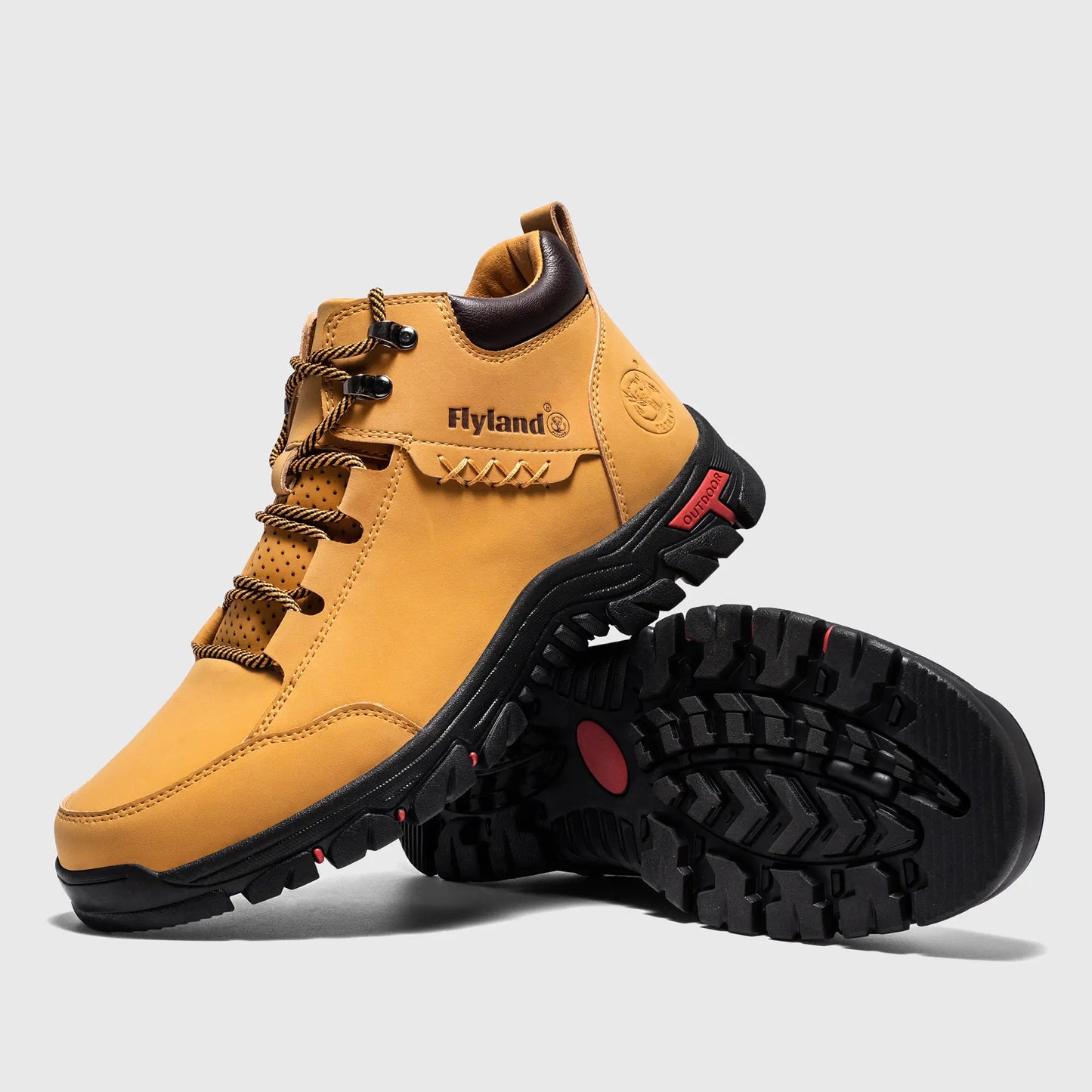 Angled view of Flyland wheat boots Land7728 highlighting the stylish plain toe and metal D-ring eyelets.