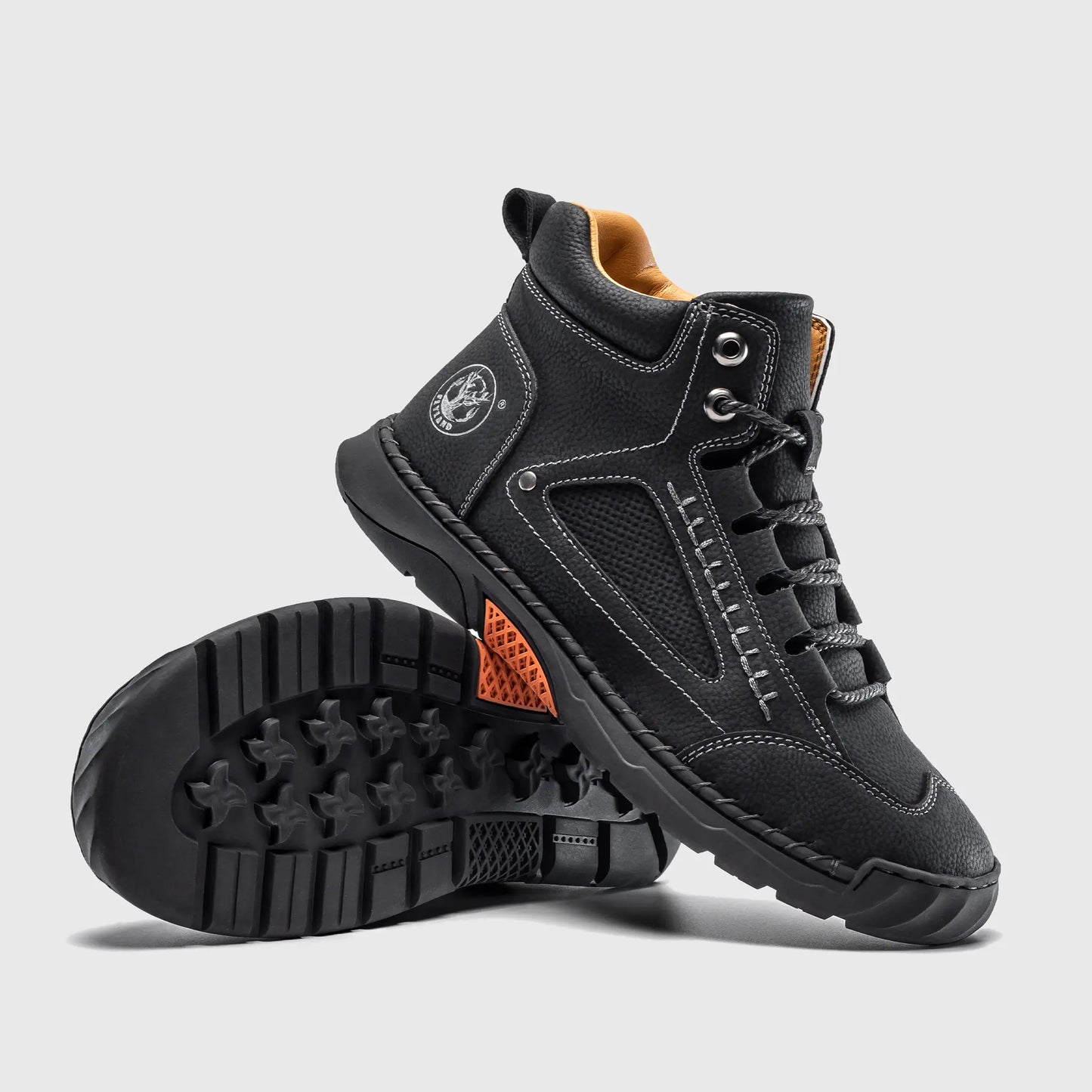 Bottom view of Flyland black boots. The design features a clean plain toe aesthetic with a flexible, sneaker-like flat sole.