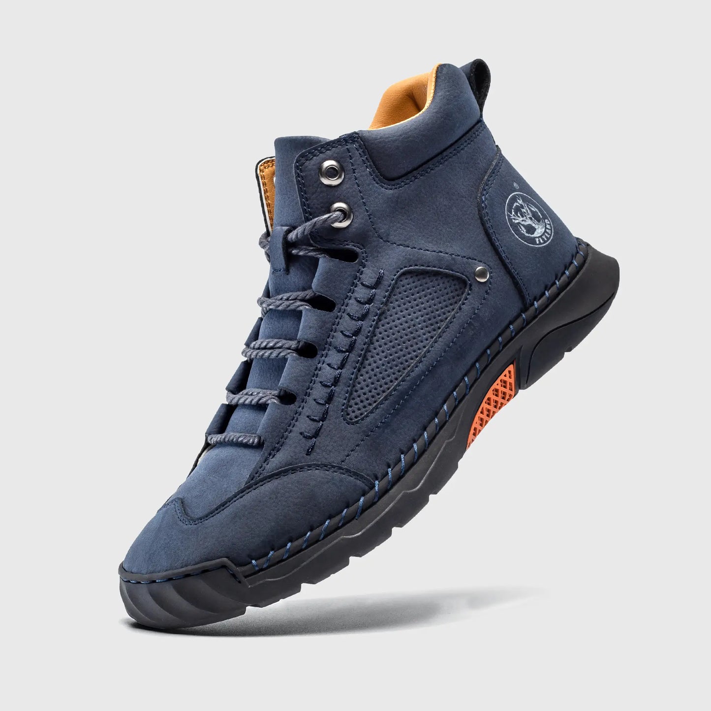 Floating view of Flyland plain toe boots, showing the lightweight construction and flexible blue upper material.
