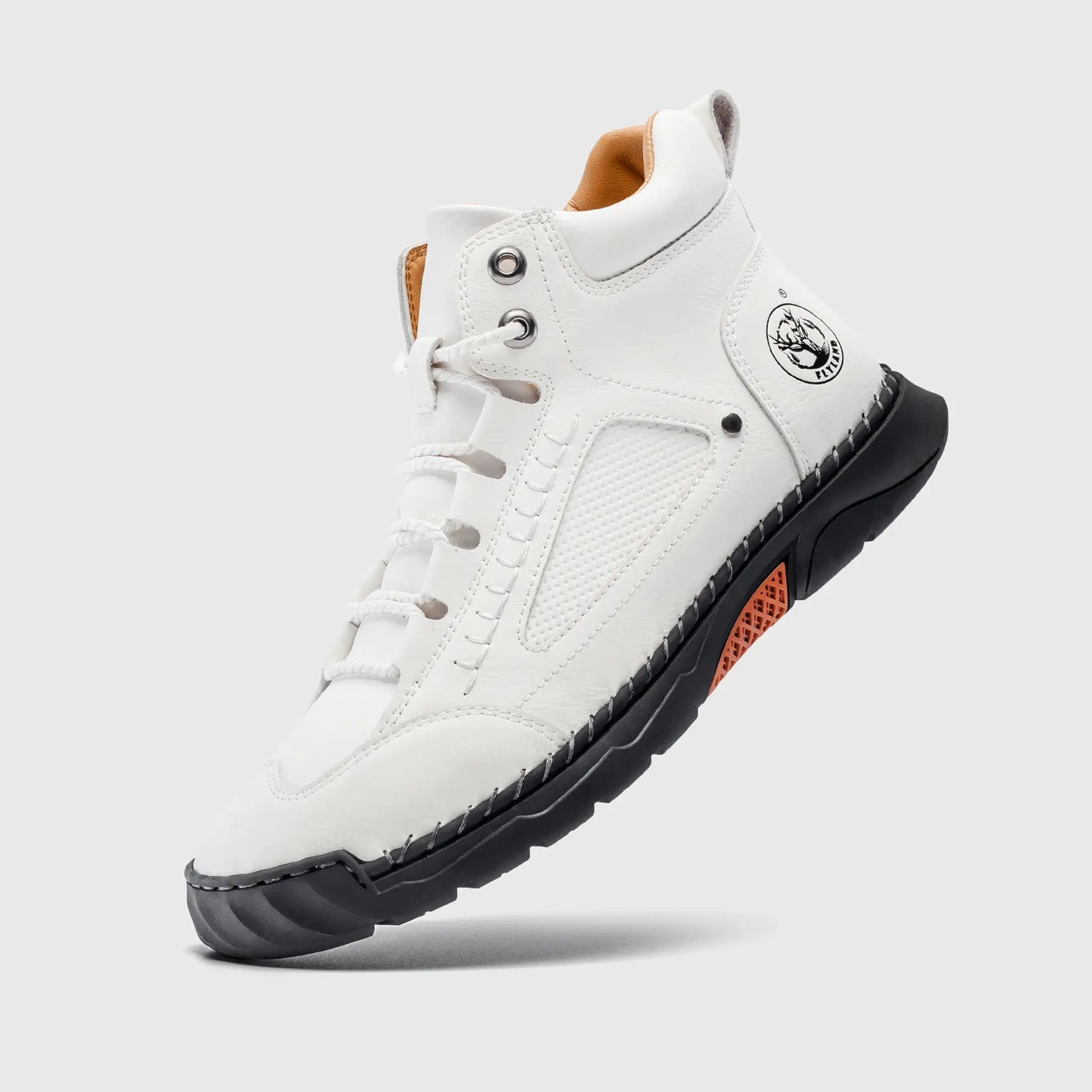 Floating view of Flyland white boots. Lightweight plain toe boots that combine a modern sneaker look with durability.