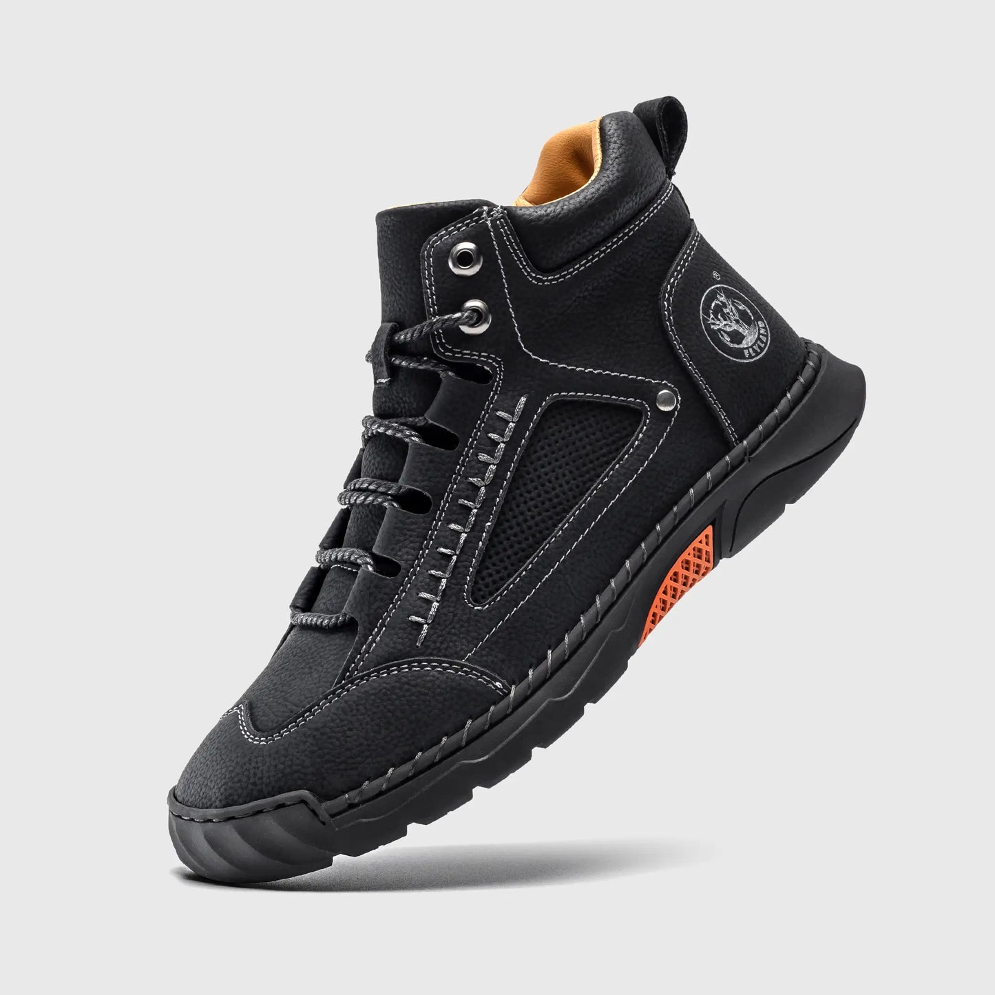 Floating view of Flyland black boots. Lightweight plain toe boots combining sneaker comfort with a rugged look.