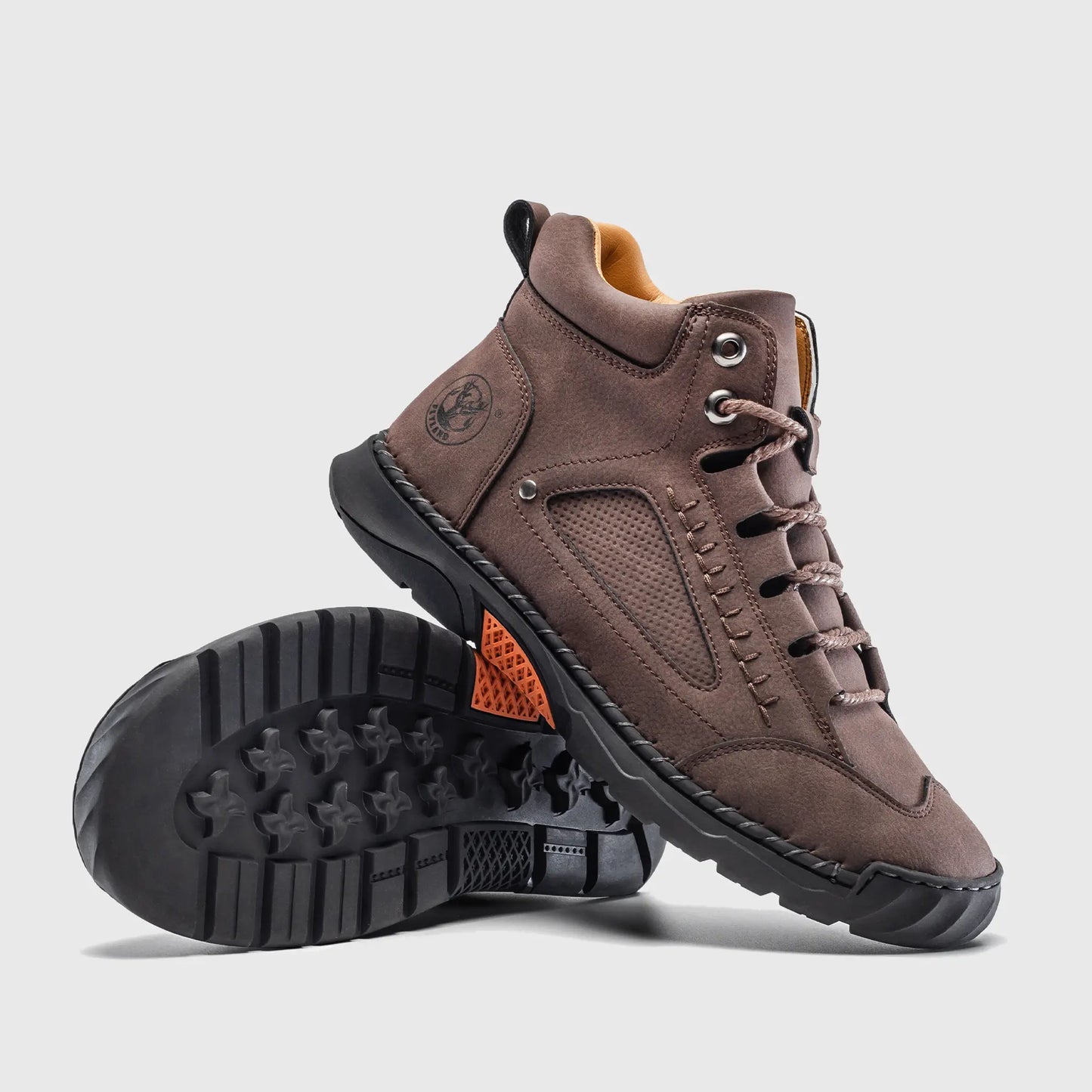 Bottom view of Flyland lace up boots. The design combines a soft toe aesthetic with a flexible flat sneaker sole.