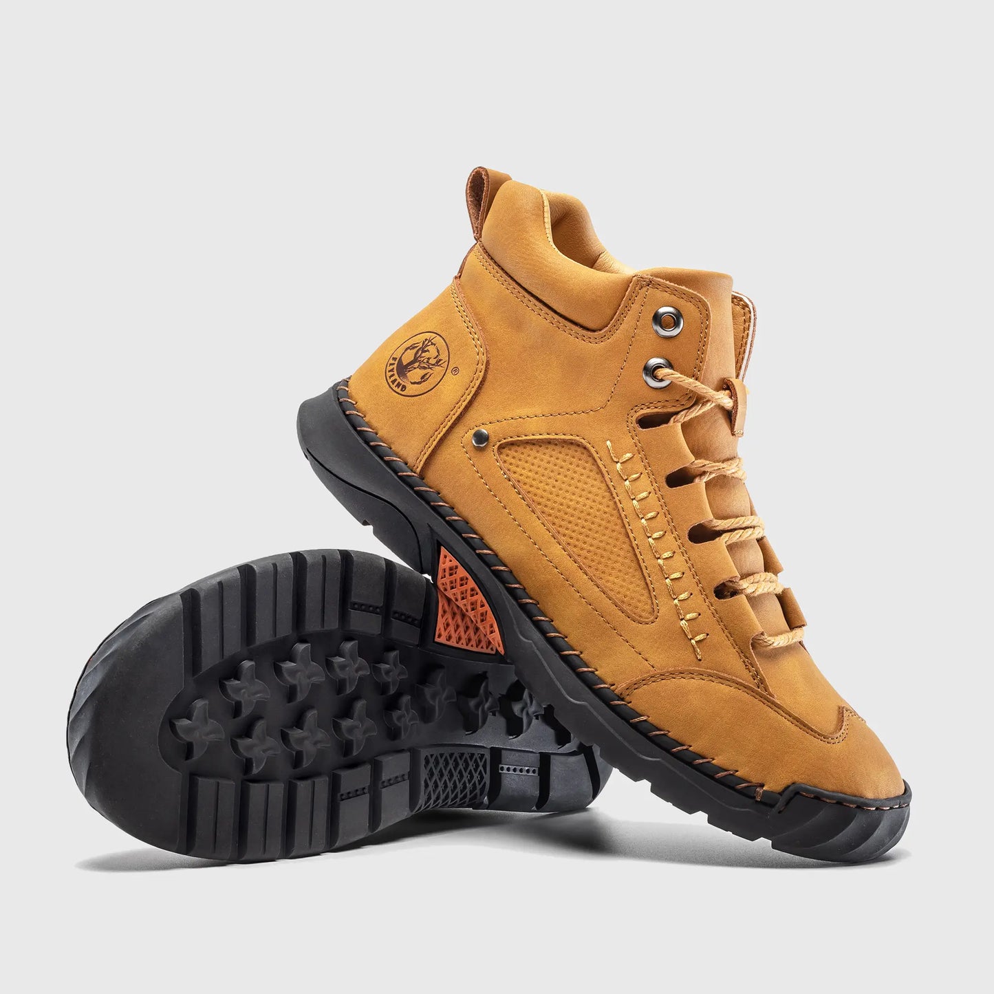 Underside view of Flyland yellow boots. The design features a soft toe work boot look with sneaker-like comfort.