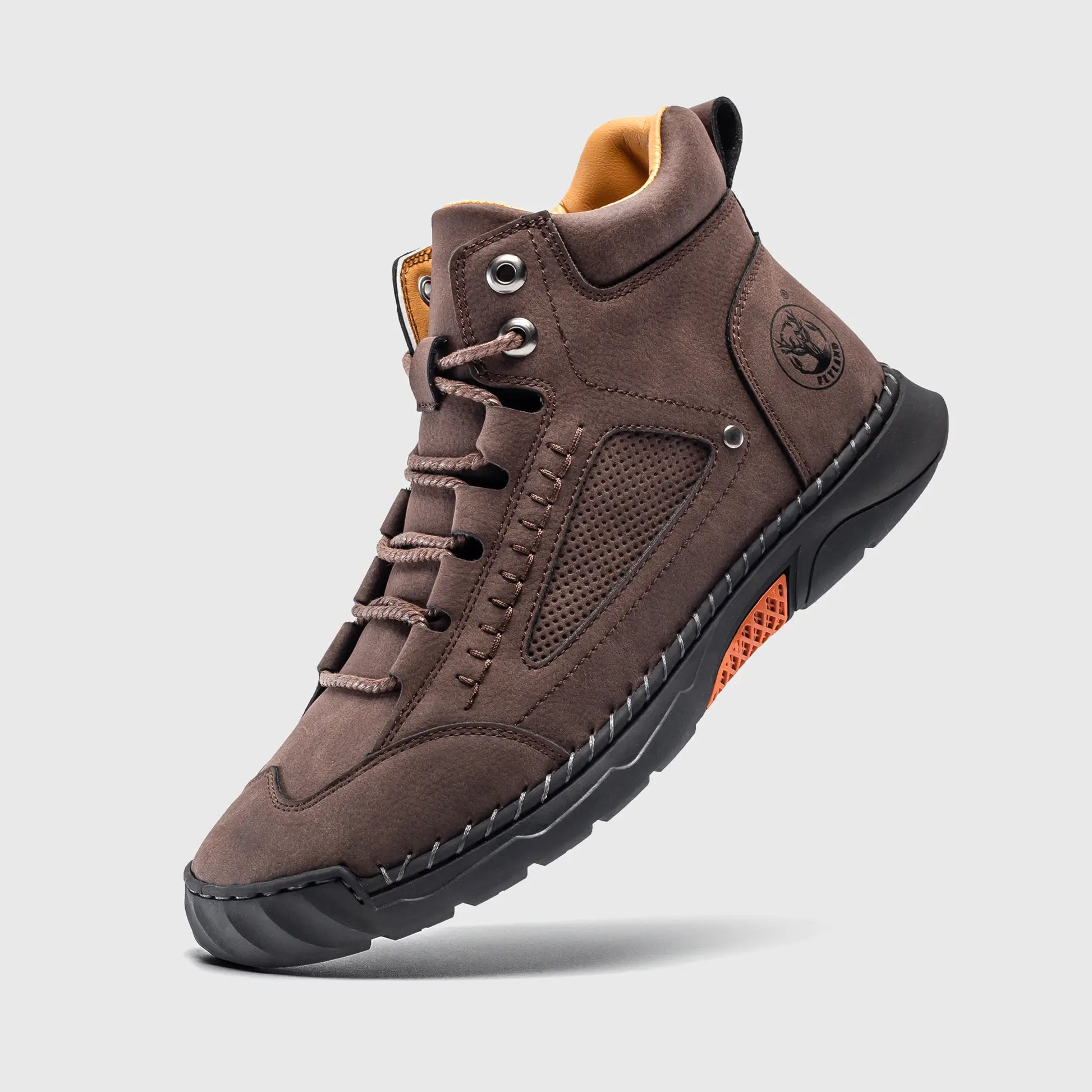 Floating view of Flyland dark brown boots. These feature a tough soft toe work boot look but are lightweight for comfort.