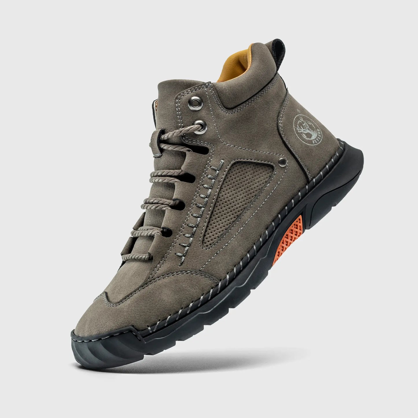 Floating view of Flyland gray boots. These feature a rugged soft toe work boot look but offer lightweight comfort.