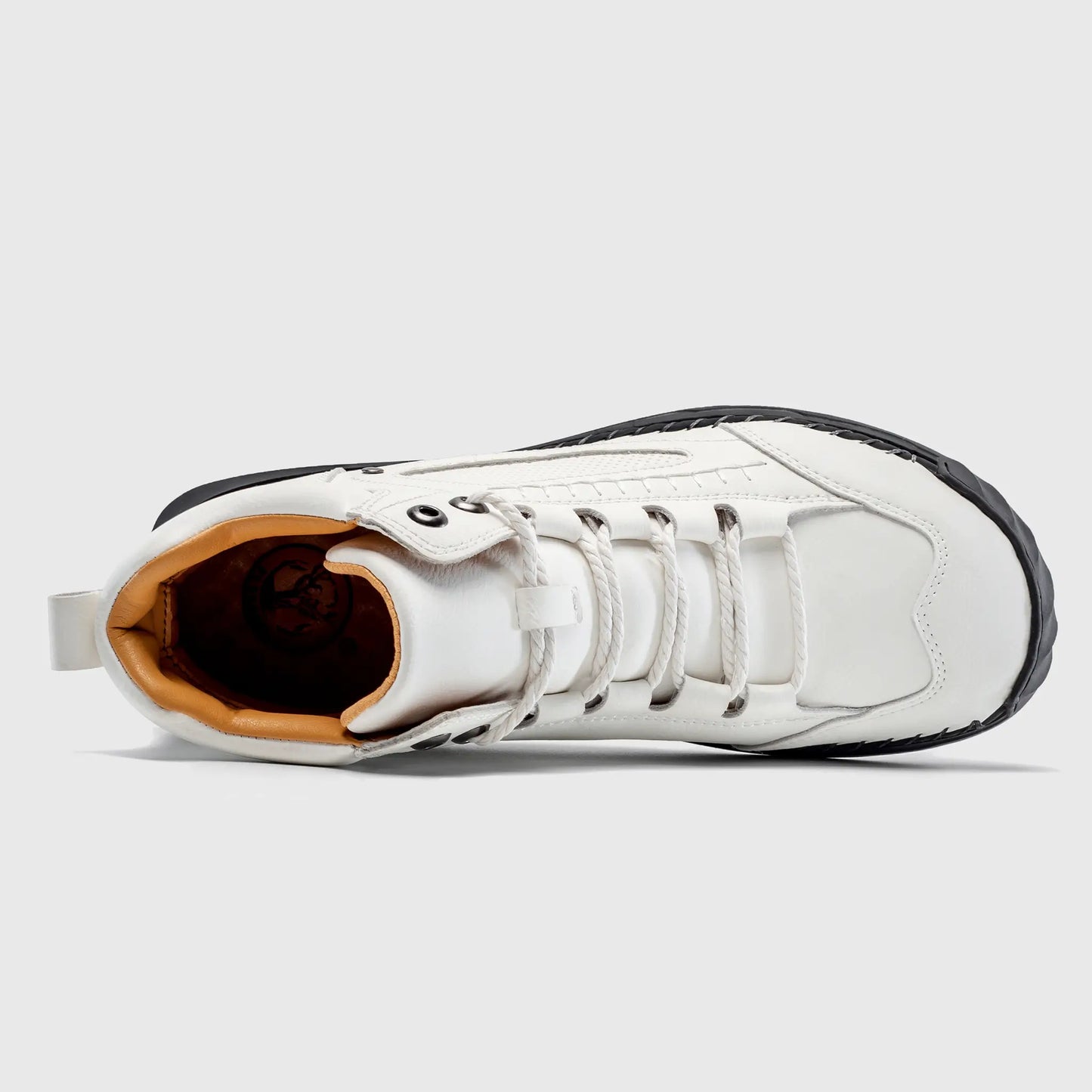 Top down view into Flyland white lace up boots, highlighting the cushioned collar and breathable interior lining.